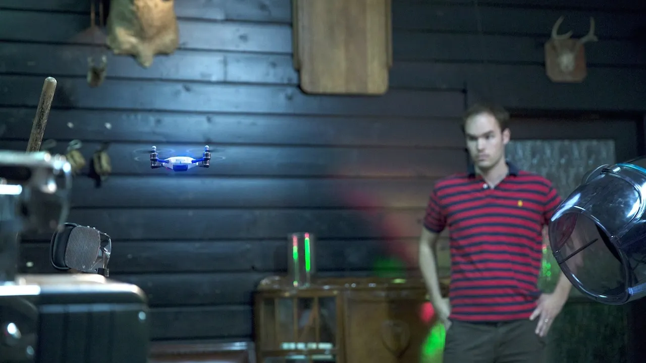 person looking at a drone